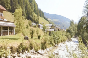 Alpine-River-Houses-On-Other-Side